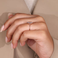 Solitaire diamond engagement ring with six prong setting.