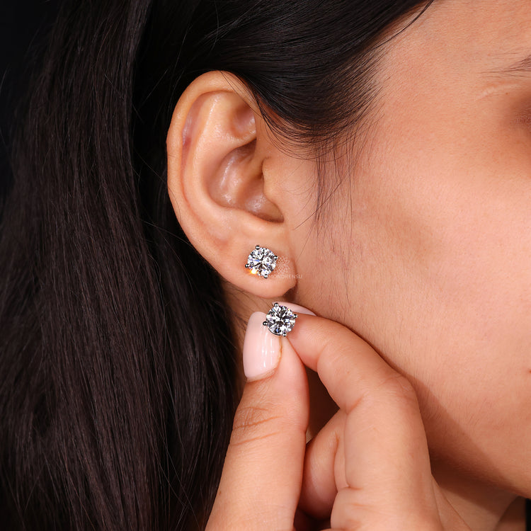 Round stud earrings in handmade jewelry design for an elegant and unique touch.