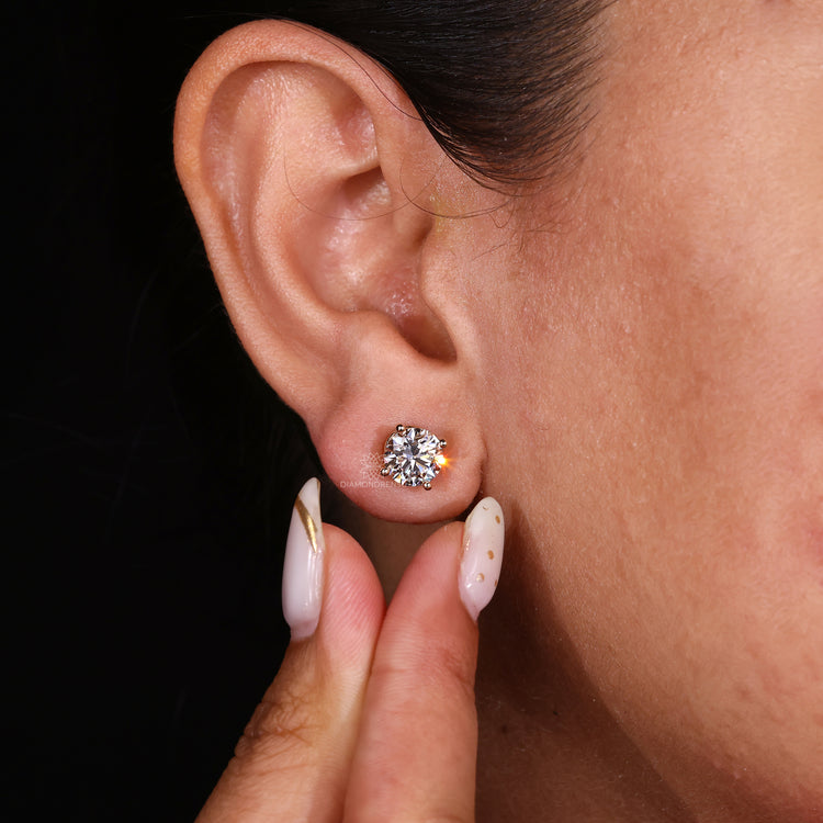 Unique handmade jewelry featuring gold diamond earrings.