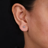 Classic diamond earrings round for an elegant look.