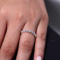 Shared prong wedding band designed for a secure fit.
