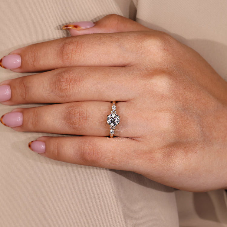 Buy Engagement Ring featuring round cut diamonds and six claw prong design.