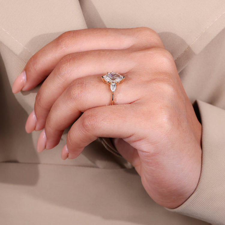 Custom engagement ring featuring Dutch marquise ring, tapered shank band, and four claw prong setting with lab grown diamond.