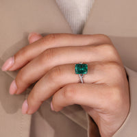 IGI certified handmade ring featuring green emerald and twisted shank.