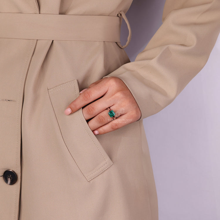 Handmade jewelry featuring Asscher cut emerald ring.