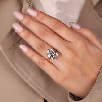 Handmade jewelry emerald cut diamond ring.