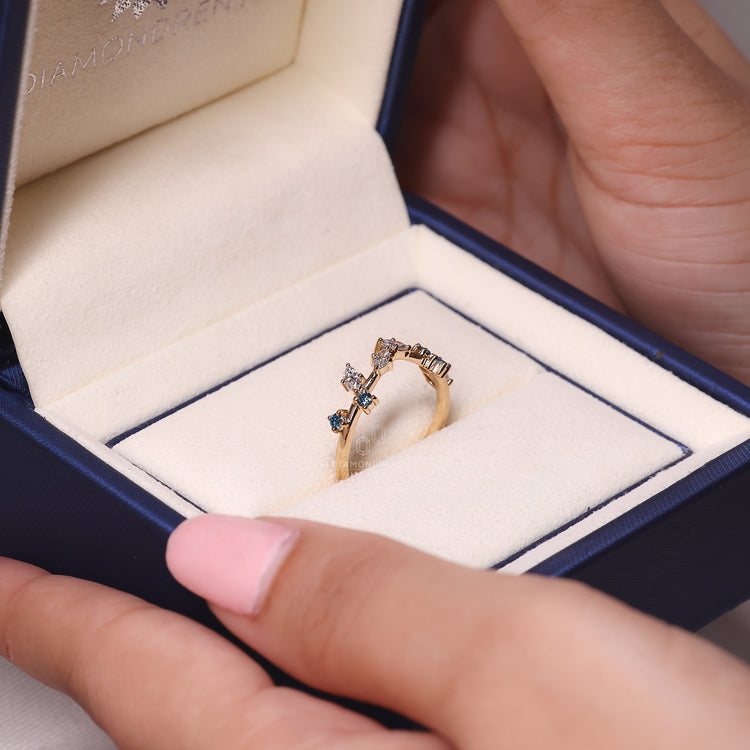 Yellow gold wedding band paired with a prong setting.