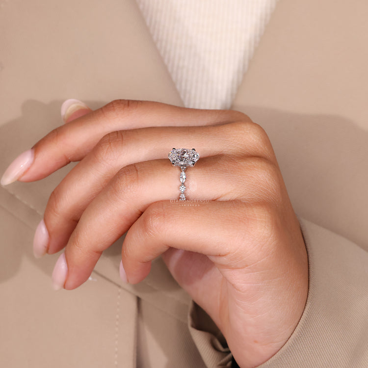 Diamondrensu ring with a shared prong design and sparkling round cut diamond.