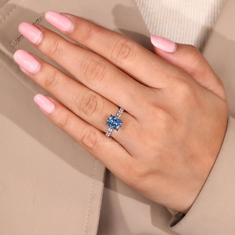 Buy engagement ring with blue diamond cushion cut in white gold.
