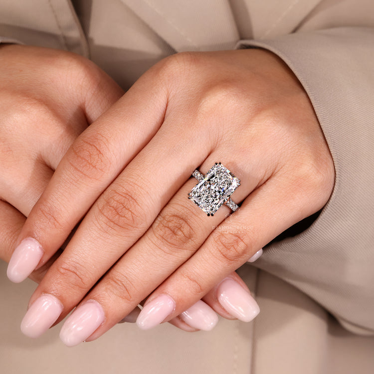 Pave round diamond ring with radiant center.