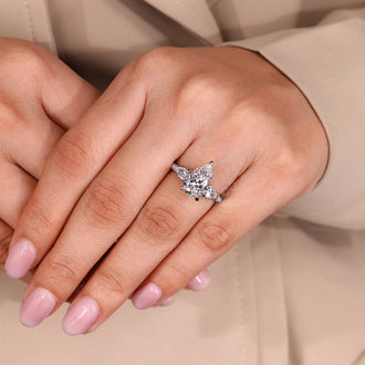 Buy engagement ring with pear cut diamond and white gold band.