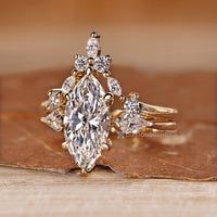 Marquise and round band pair with the curvy band.