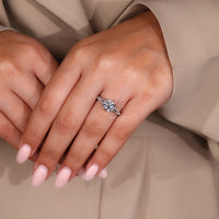 Cushion old european diamond ring with tulip setting and eight claw prongs.