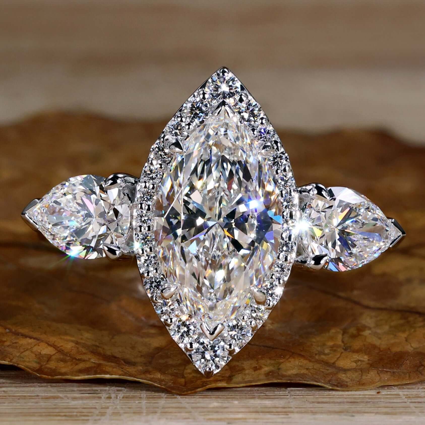 Marquise and Pear Cut Lab Grown Diamond Three Stone Engagement Ring