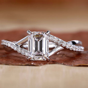 Stunning emerald cut diamond ring with a clear, elegant stone set in a refined band