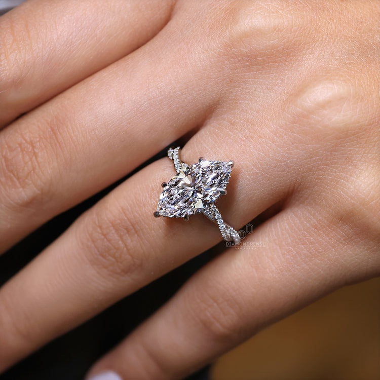 Hidden halo ring with round diamond accent.