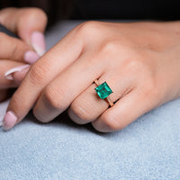 Buy custom asscher cut emerald engagement ring online.