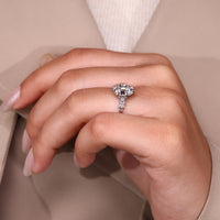 Cushion old mine diamond with round side stones by Diamondrensu.