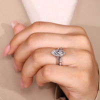 Nature inspired marquise ring with six leaf prongs.