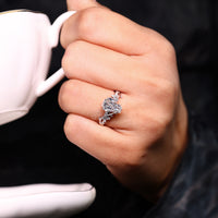 Handmade engagement ring with twisted shank and cathedral setting.