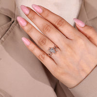 Coffin center diamond ring with bypass setting and prong details.