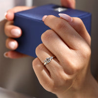 Leaf style engagement ring with old European cut diamond.