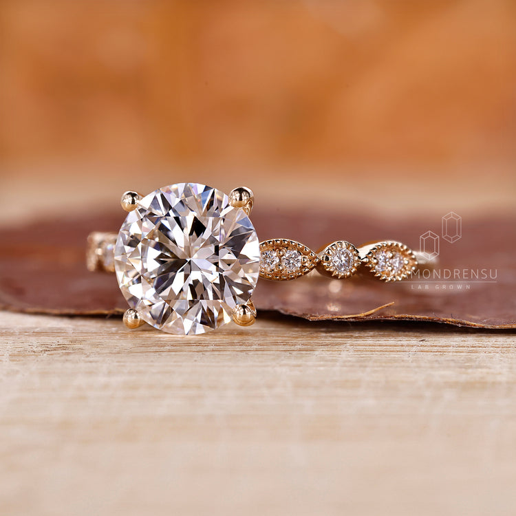 Lab grown diamond in a round diamond engagement ring.