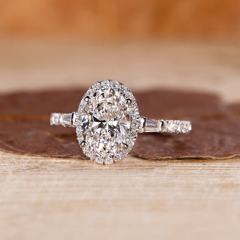 Oval cut diamond ring with a classic halo engagement ring setting.