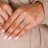 Custom radiant diamond ring with leaf-style prong and IGI certified stone