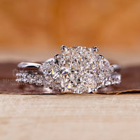 Lab grown diamond in a cushion cut setting with 4 round prong setting for secure placement.