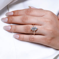 Hidden halo engagement ring with a round center stone.
