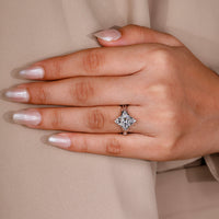 Round side stone ring paired with marquise cut engagement ring.