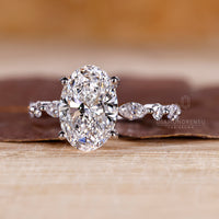 White gold ring with a flawless oval cut diamond for timeless appeal.