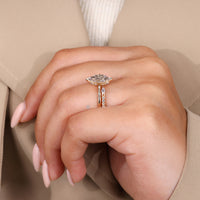 Compass prong setting secures the center stone.