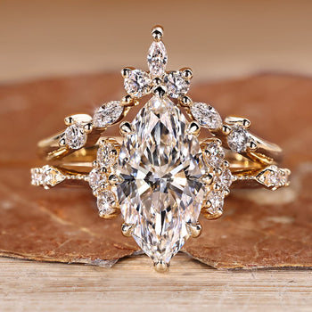Marquise wedding ring with round side stones and vintage style.