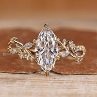 Diamondrensu marquise ring with lab grown diamond center stone.