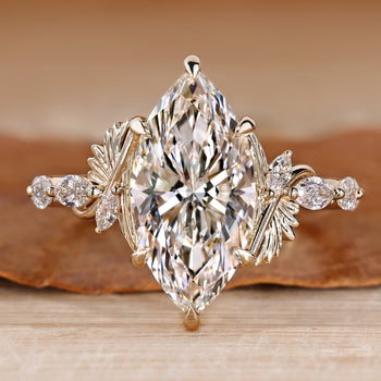 Marquise cut diamond ring with marquise side stones.