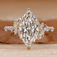 Marquise cut diamond ring with marquise side stones.