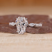 Diamondrensu coffin ring with lab grown diamond center stone.