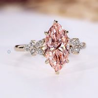 Handmade marquise engagement ring with pink center diamond.