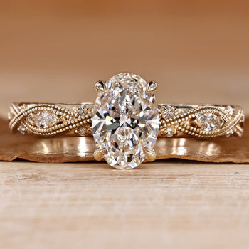 Oval diamond ring with round and marquise side stones.