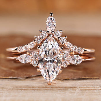 Marquise wedding ring with marquise and round side stones.