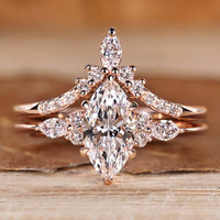 Marquise wedding ring with marquise and round side stones.