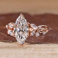 Diamondrensu marquise ring with lab grown diamond center.