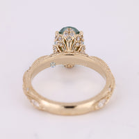 Handmade oval ring with marquise shaped round diamond outline.