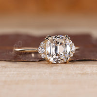 Vintage inspired OMC diamond ring with round side diamonds.