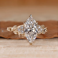 IGI certified marquise diamond ring with round diamond accents.
