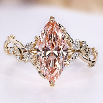 Nature inspired diamond ring with a pink marquise center stone.