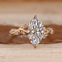 Nature inspired style shapes this marquise engagement ring.