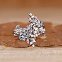 Pink marquise diamond band in a custom engagement ring.